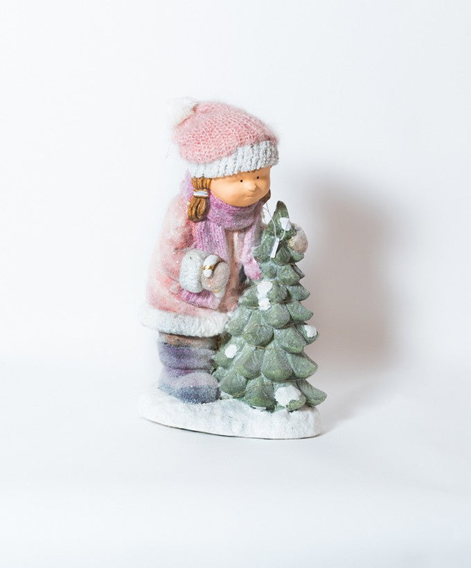 BAMBINA CON ALBERELLO INNEVATO E LUMINOSO